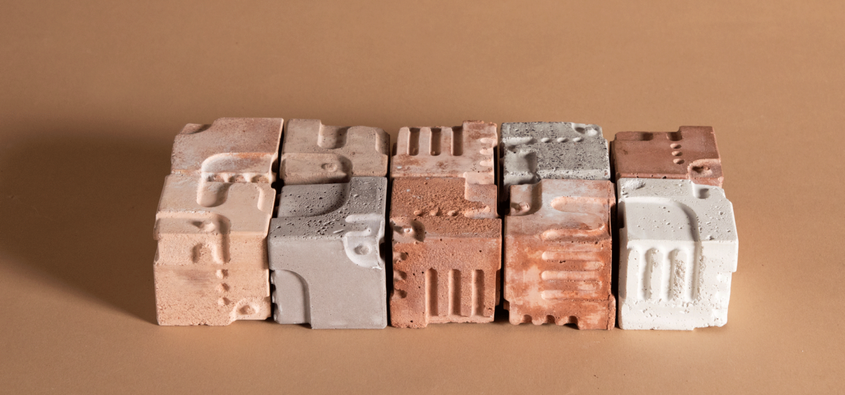 Bild zeigt 10 Würfel aus geopolymer, die verschiedene Muster bilden, in denen Fabelwesen zu erkennen sind